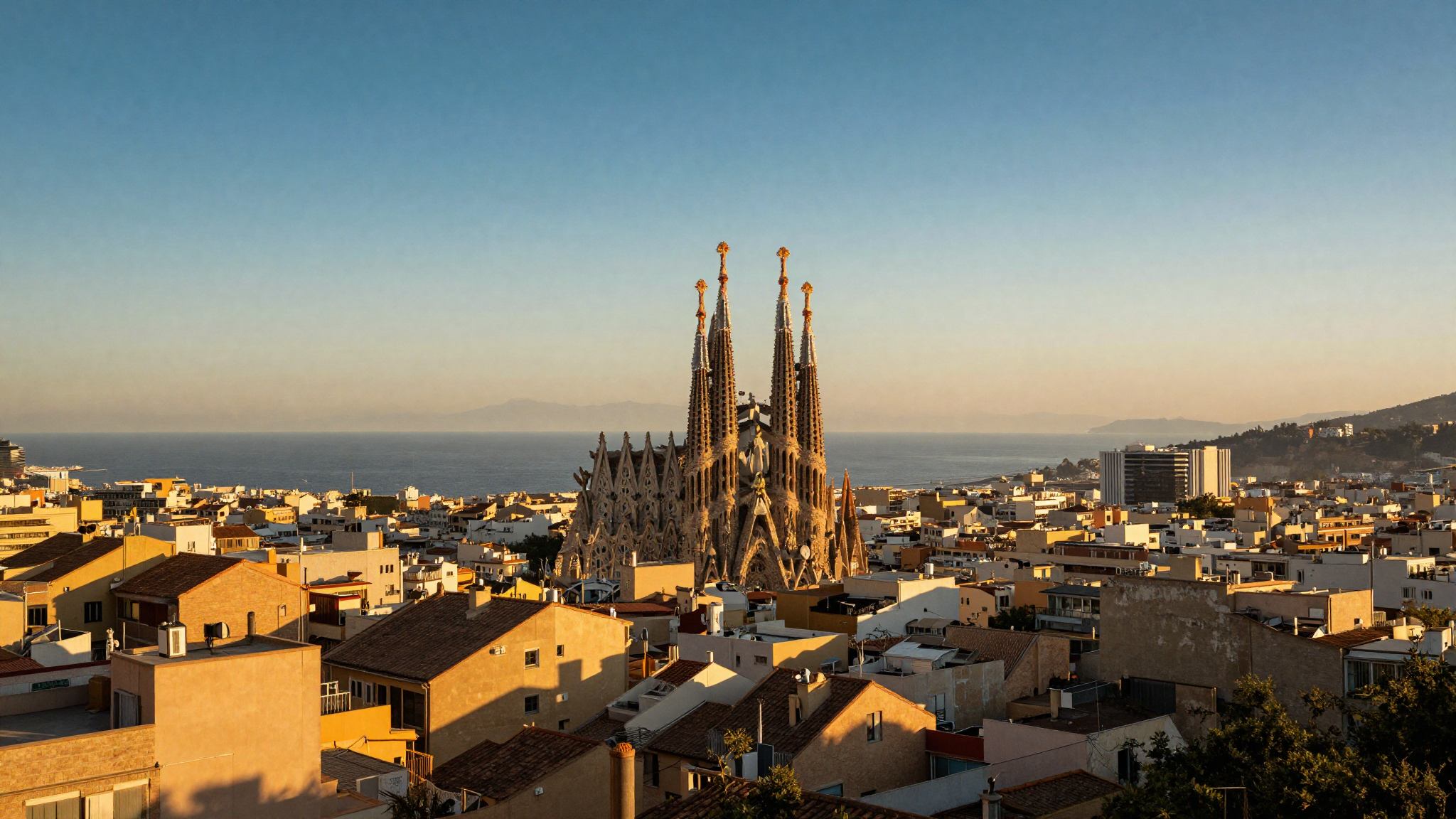 Barcelona skyline at golden hour with the Sagrada Família